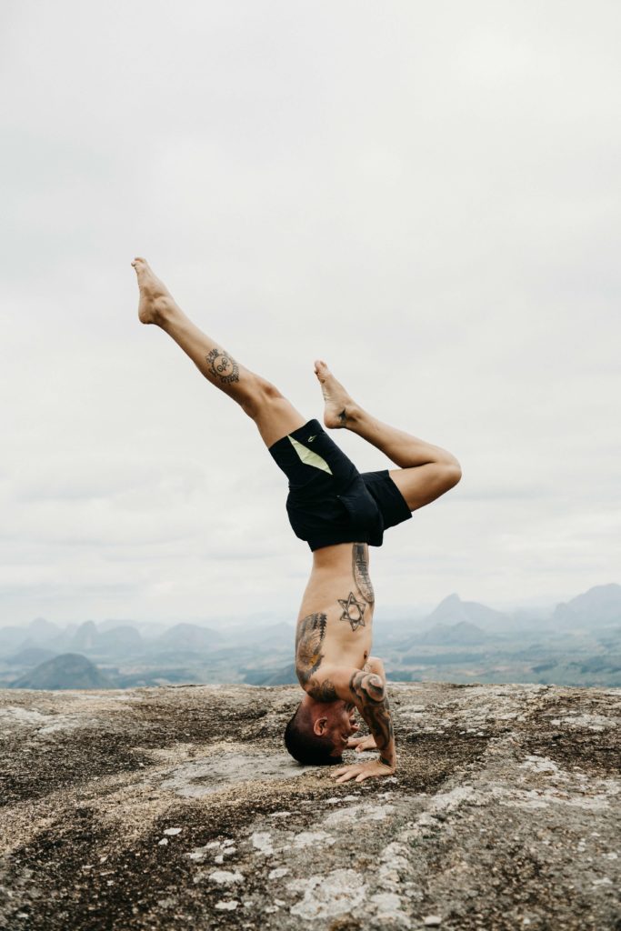 Man an doing yoga for holistic health