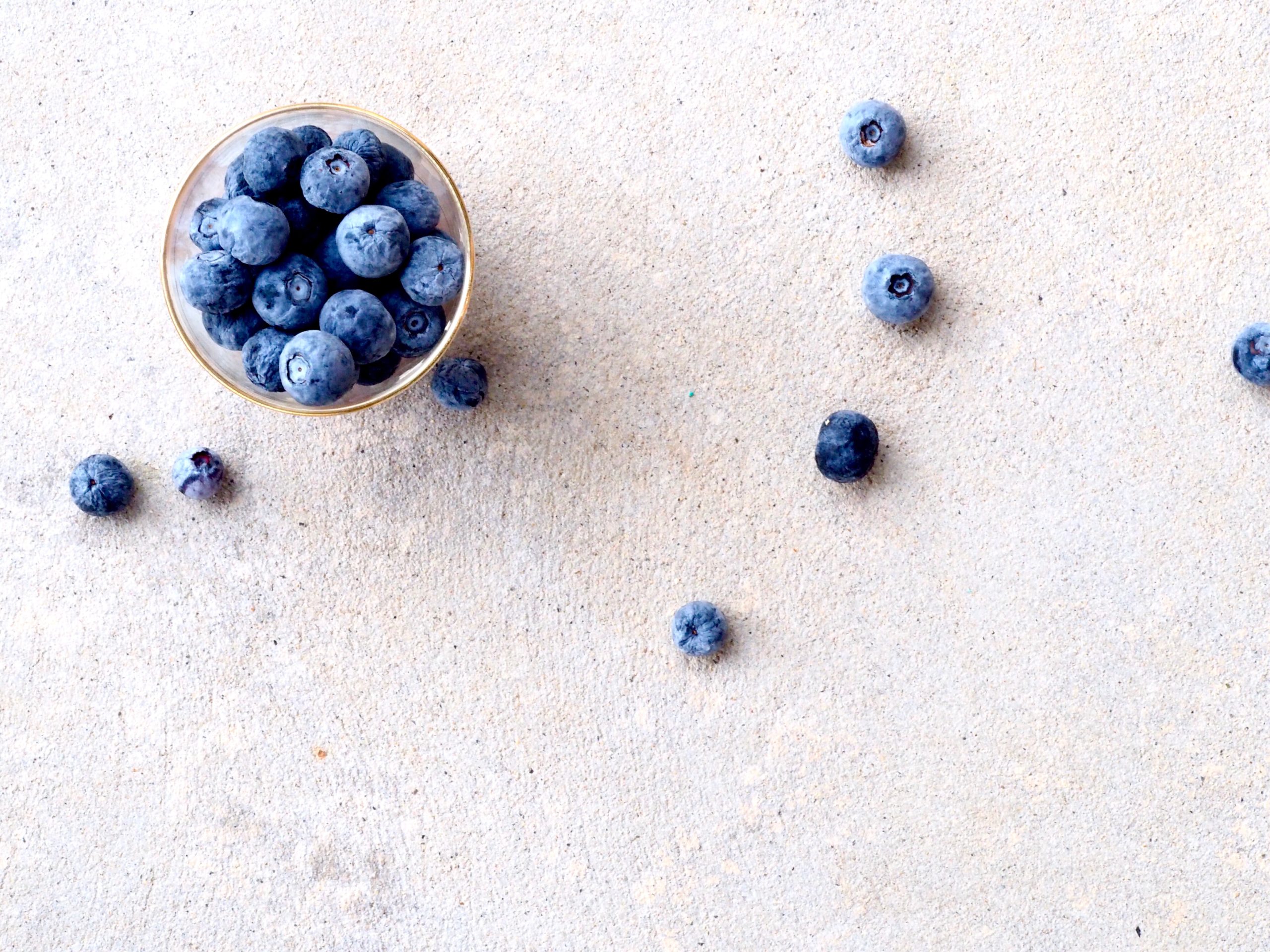 Blueberries scattered to nurture your physical health and wellbeing