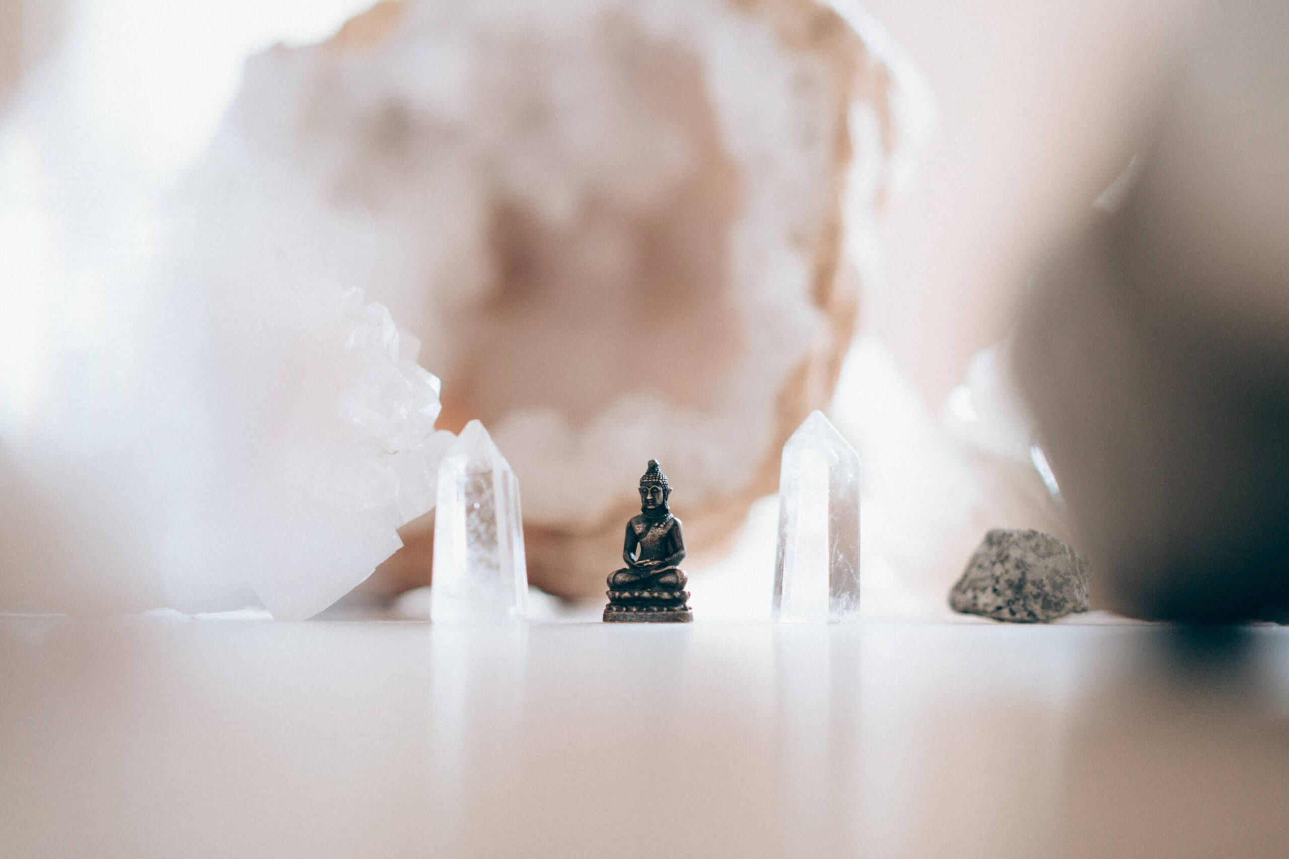 Small buddah and crystals as mindfulness can help in uncertainty