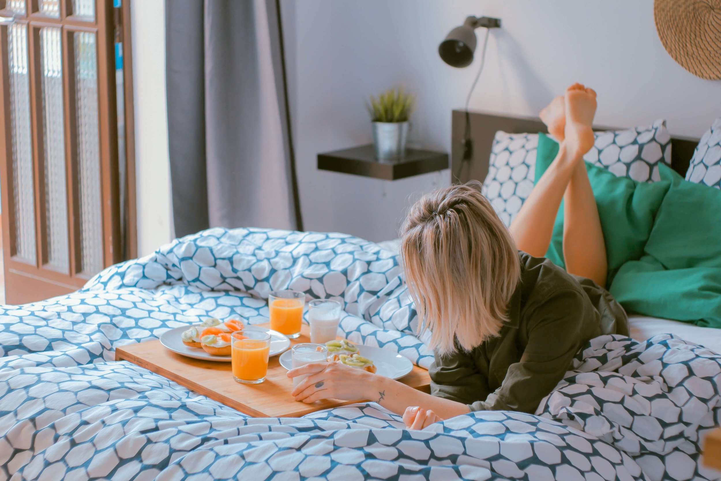 Woman on the bed at home keeping healthy habits in the new normal