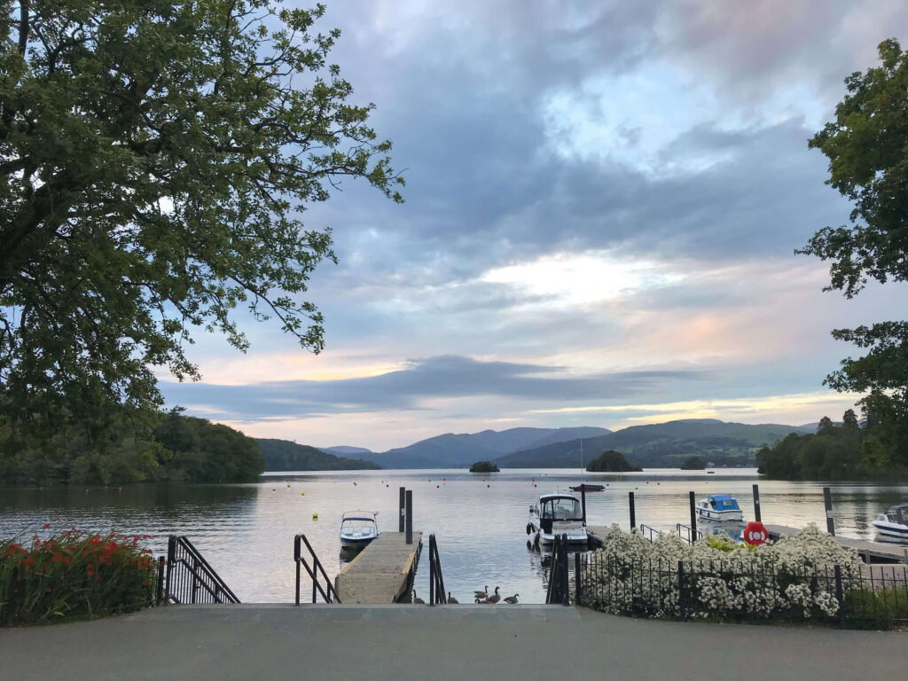 Cloudy sunset over Lake Windemere with boats