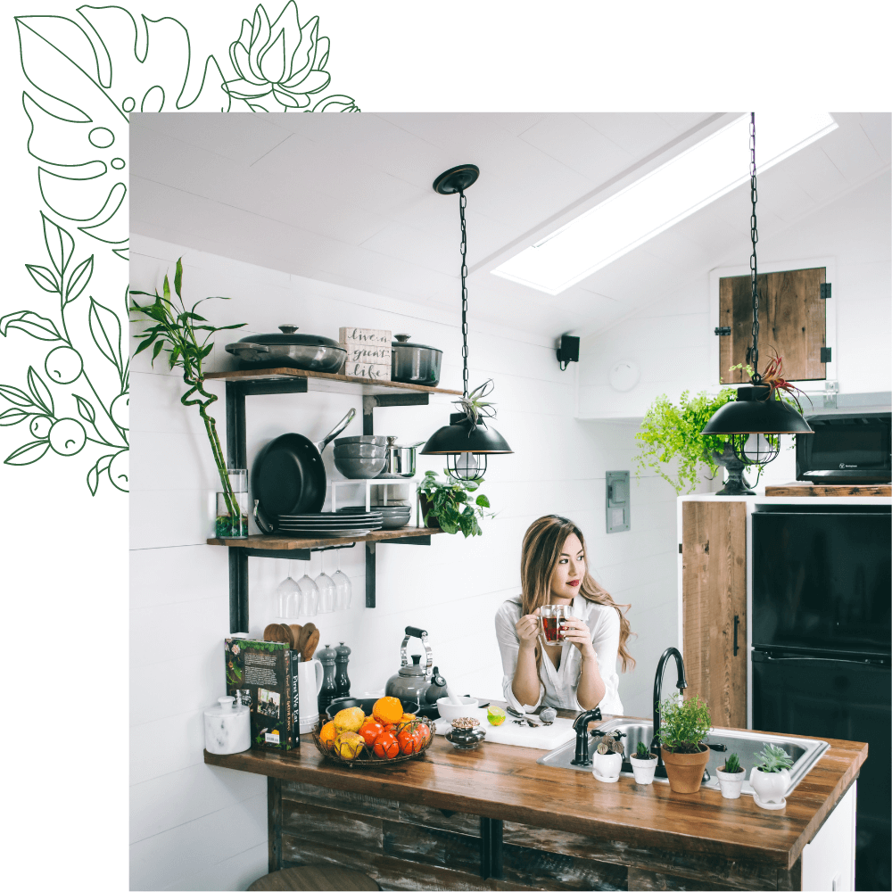 woman in kitchen with mind medicine leaves design