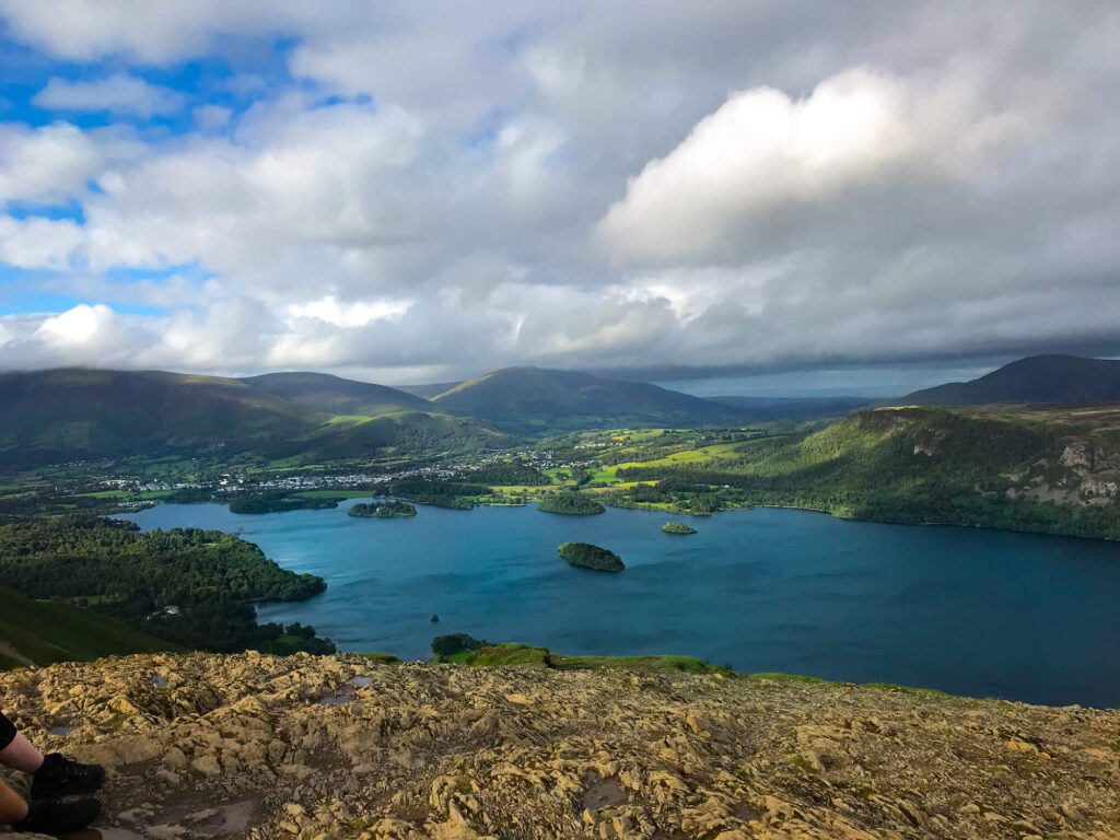 View of lake district from the top of Catbells, blue lake and green hills